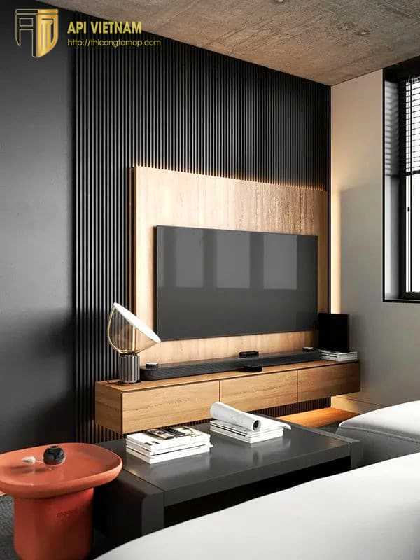 Sự sang trọng, đẳng cấp của phòng khách được nổi bật nhờ vách ốp tường tivi từ tấm nhựa giả gỗ